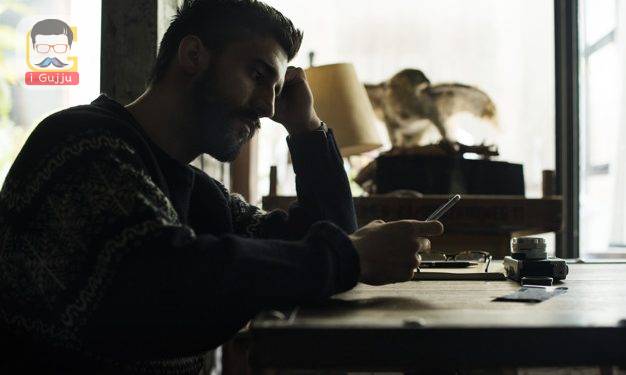 A man holding using smartphone